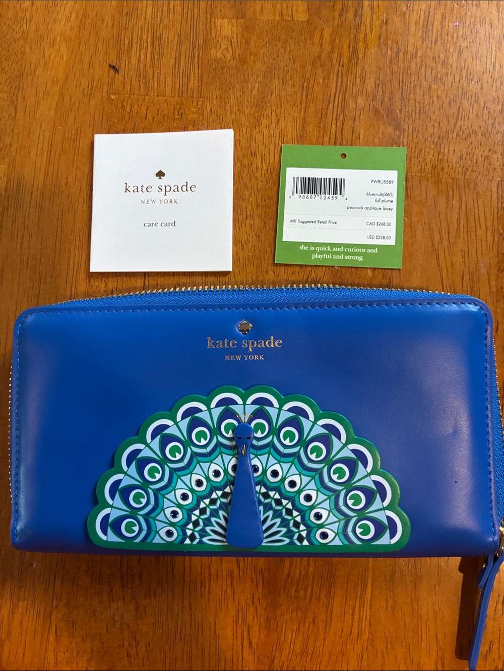 kate spade blue peacock-print leather wallet
